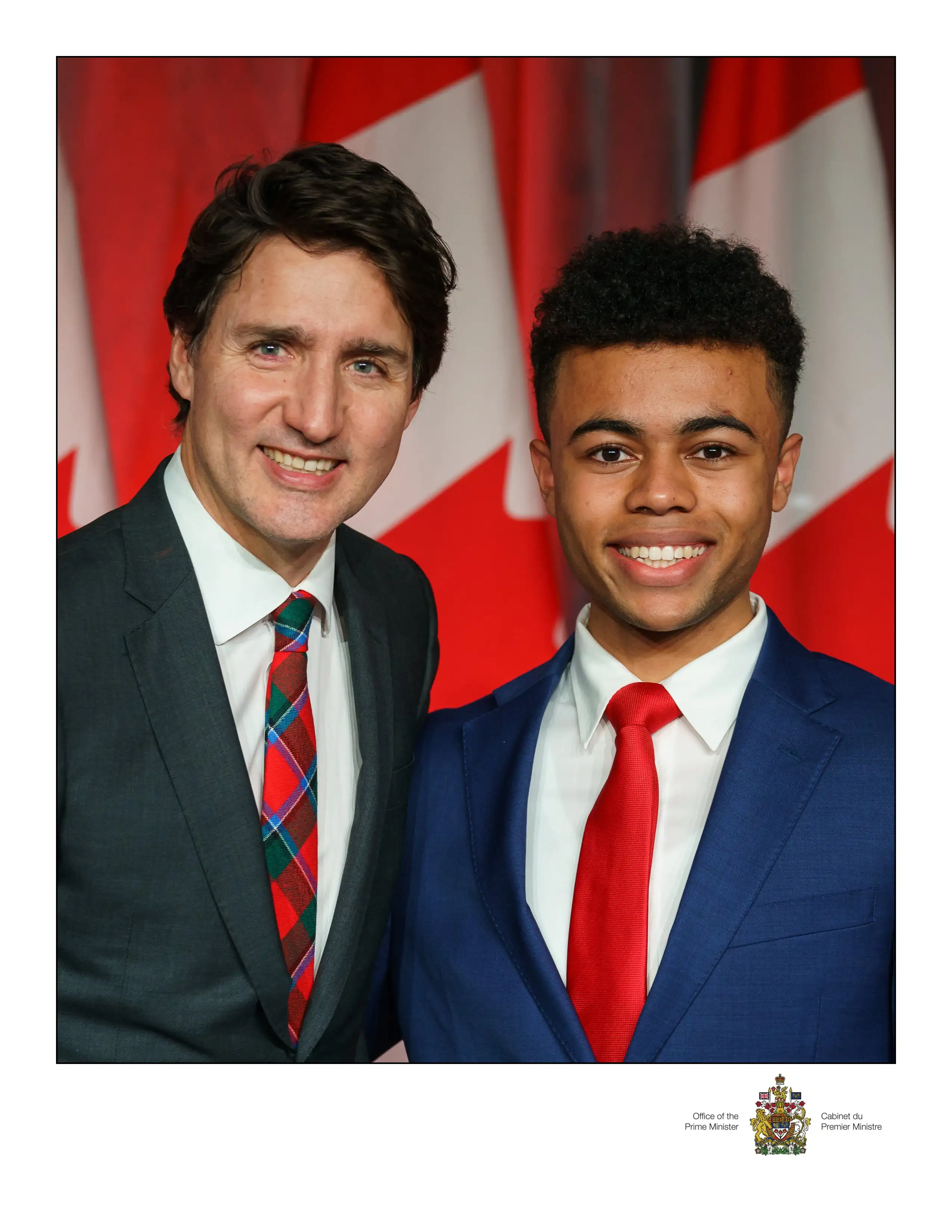 Ehab posing with Canadian Prime Minister Justin Trudeau.